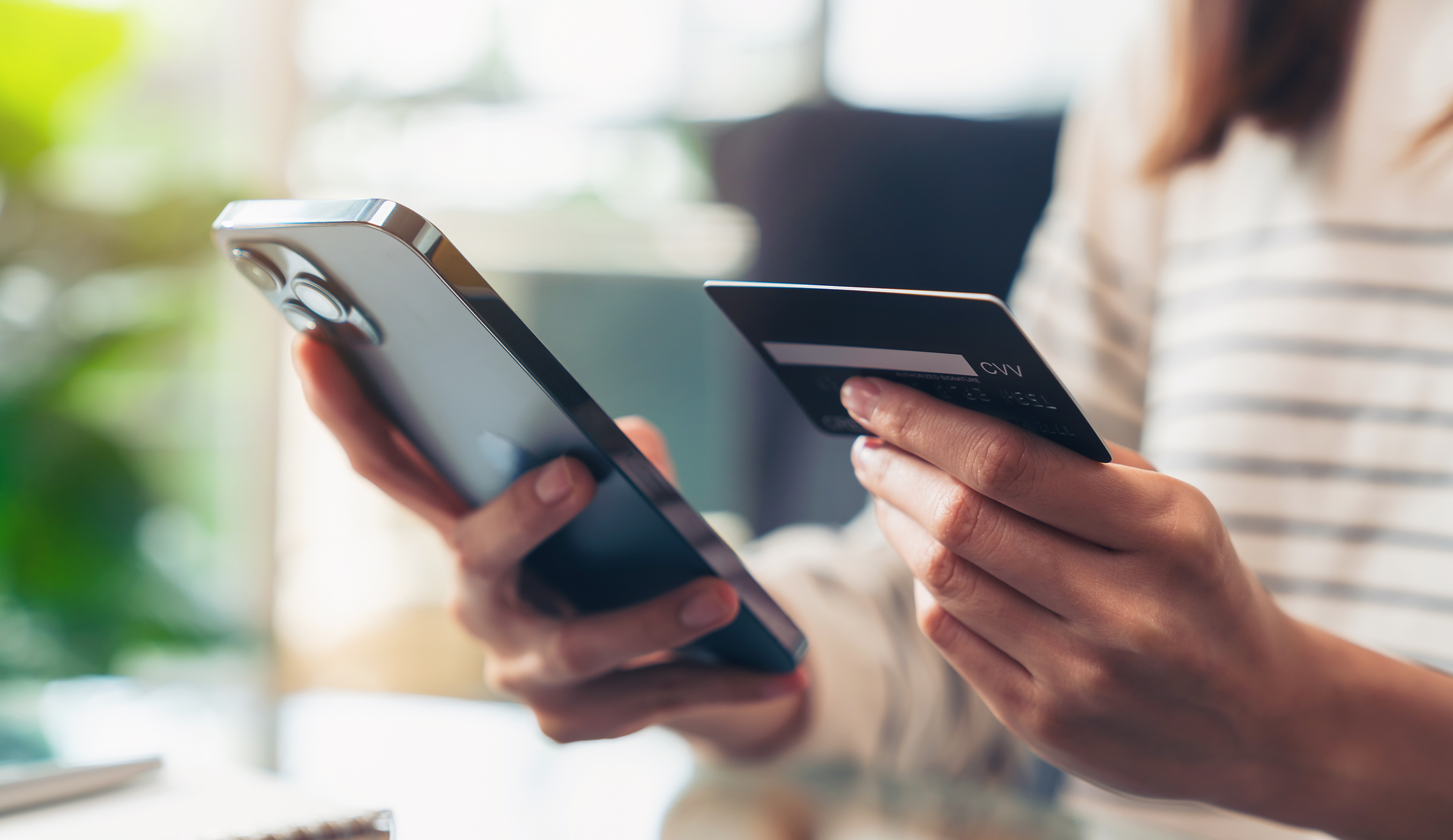 Banking and Teams Woman entering credit card information on phone