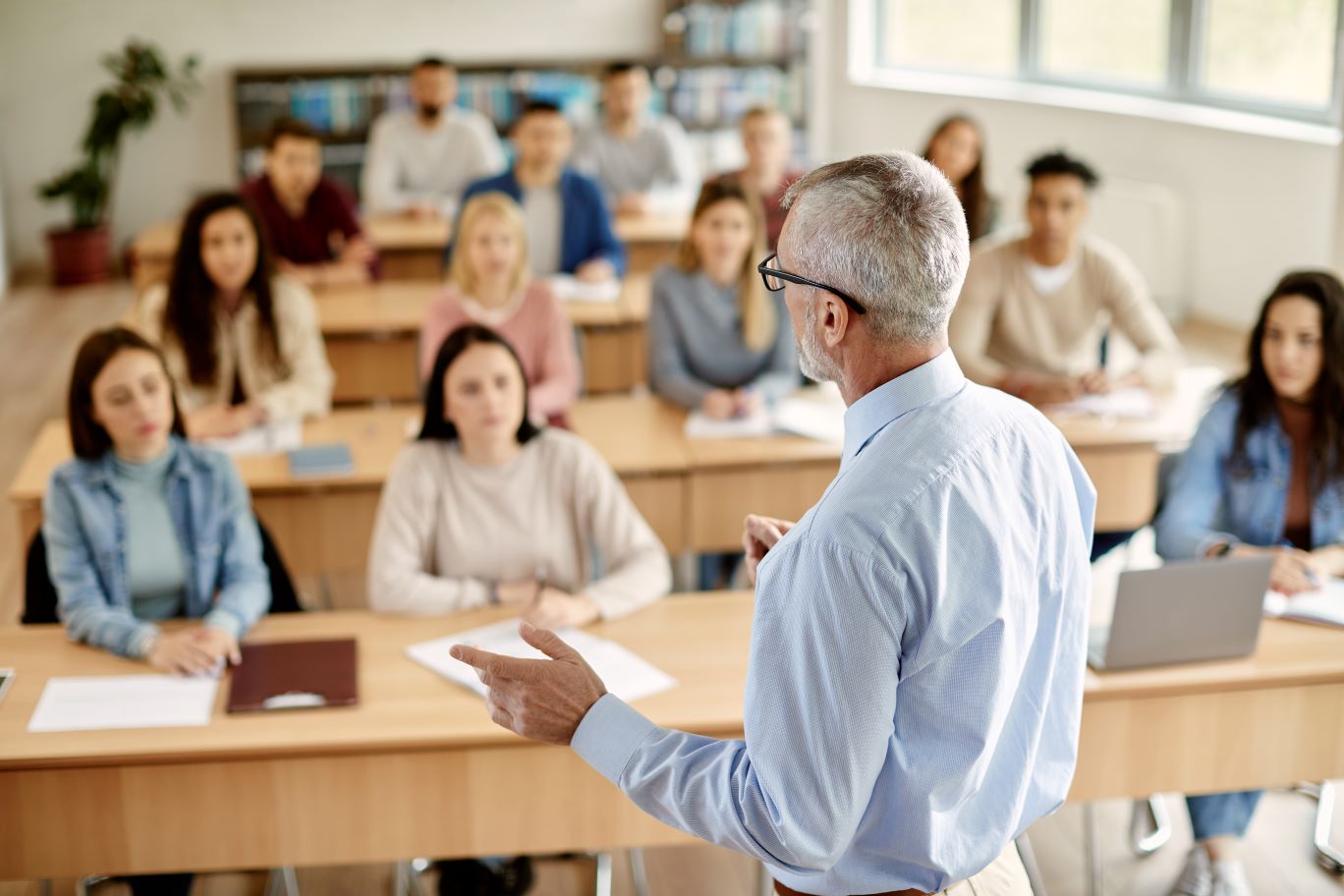 Professor Teaching a Group of Students